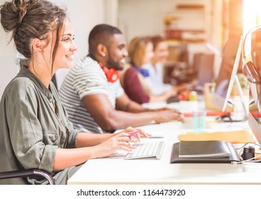 Young trendy teamwork using computer in creative office - Business people working together at web site project - Focus on woman right hand - Technology, influencer, marketing and job concept - Shutterstock ID 1164473920