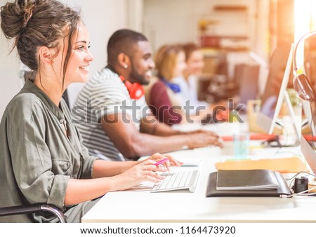 Young trendy teamwork using computer in creative office - Business people working together at web site project - Focus on woman right hand - Technology, influencer, marketing and job concept
