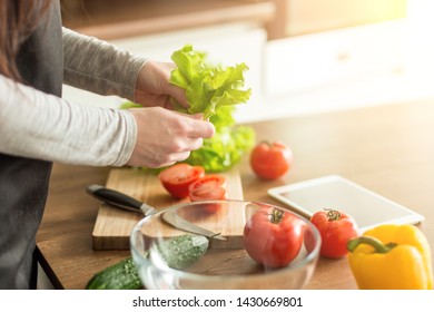 Young Trendy Woman Cooking Healthy Food In The Morning