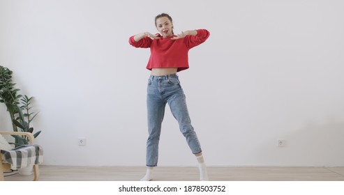 Young Trendy Woman Dancing At Home. Social Media Concept