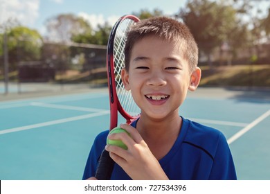 Young Tween Asian Boy Tennis Beginner Player On Outdoor Blue Court, Kid Child Sport Concept