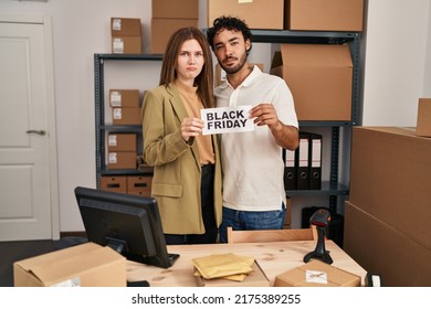 Young Two People Holding Black Friday Banner At Small Business Store Depressed And Worry For Distress, Crying Angry And Afraid. Sad Expression. 