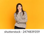 Young Ukrainian girl isolated on yellow background thinking an idea while looking up