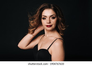 
Young Ukrainian Girl In The Studio On A Black Background In Lingerie