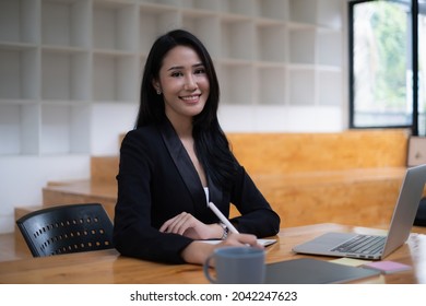 Young Undergraduate Student Studying Online Class By Laptop Computer.