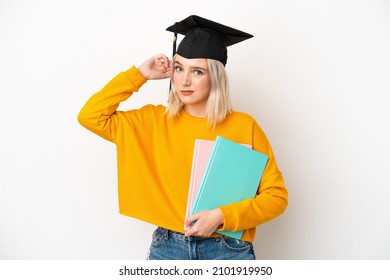 Young university caucasian woman graduate isolated on white background having doubts