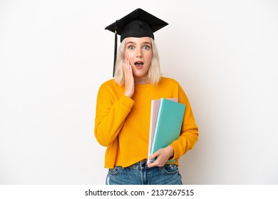 Young university caucasian woman graduate isolated on white background with surprise and shocked facial expression