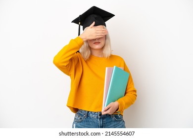 Young university caucasian woman graduate isolated on white background covering eyes by hands. Do not want to see something