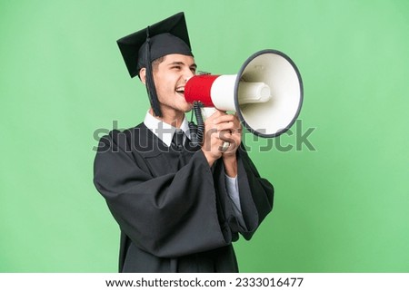 Young university graduate caucasian man over isolated background shouting through a megaphone