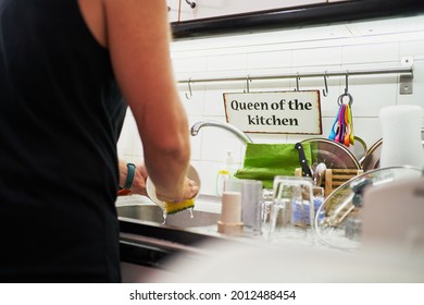 Young Unrecognizable Man Washing Dishes. Everyday Chores