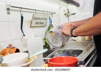 Young Unrecognizable Man Washing Dishes. Everyday Chores