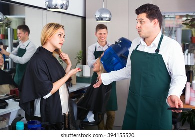 Young Upset Woman Blaming Hairdresser In Bad Haircut 