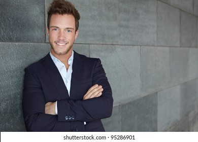 Young Urban Business Man Leaning On Wall