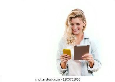 Young Very Beautiful Business Girl With A Phone And Ipad In Her Hands Smiles And Laughs At What She Saw In On A White Background