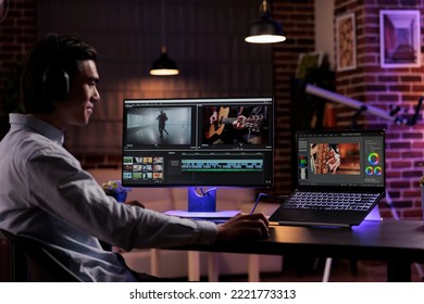 Young videographer working on video production, editing multimedia montage and movie footage to create agency content. Using software on computer to edit professional film with color grading effects. - Shutterstock ID 2221773313