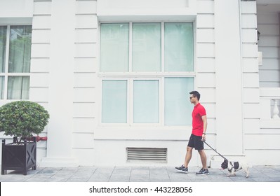 Young Vienamese Guy With His Dog