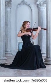 Young Violinist In The Column Hall