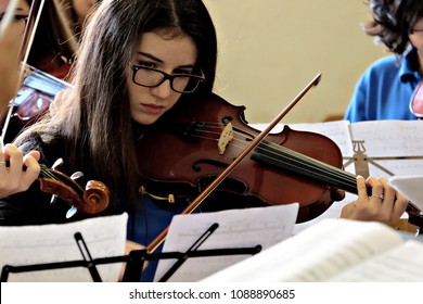 Young Violinist In An Orchestra