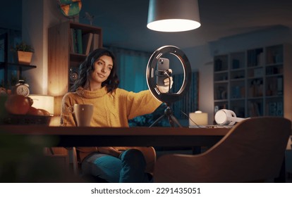 Young vlogger and content creator shooting a video for her followers, social media and communication concept - Powered by Shutterstock