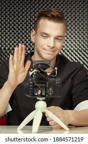 Young vlogger during process of streaming his video to public