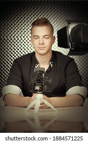 Young vlogger during process of streaming his video to public