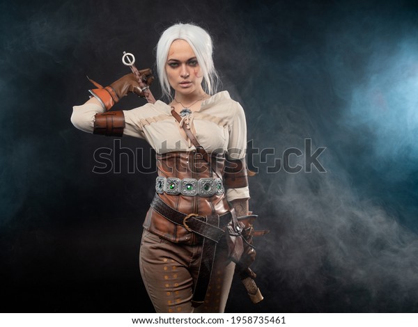 A young warrior with a sword on a dark\
background. Fantasy heroine