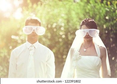 A Young Wedding Couple Couple In Funny Big Glasses