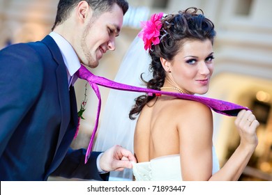 Young Wedding Couple Indoors Funny Portrait.