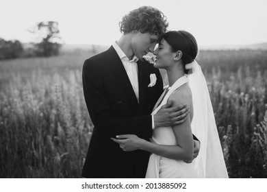 Young Wedding Couple Together In Field