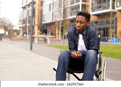 a young wheelchair user looking worried. 