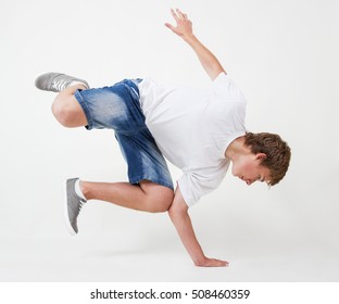 Young White B-boy Dancing Break Dance.Little Hip Hop Dancer Guy Isolated On White.Good Looking Teenager Breaker Posing In The Studio On Cut Out White Background.Cool Teene Male Model