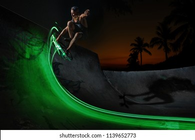 A young white Caucasian skateboarder doing an ollie jump at night - Powered by Shutterstock