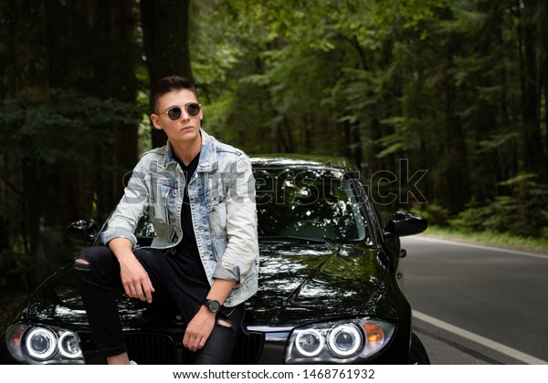 Young\
white male model posing with different\
backgrounds.