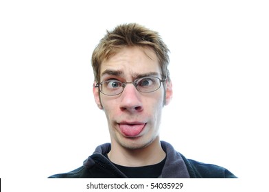 Young white male sticks his tongue out isolated on white background