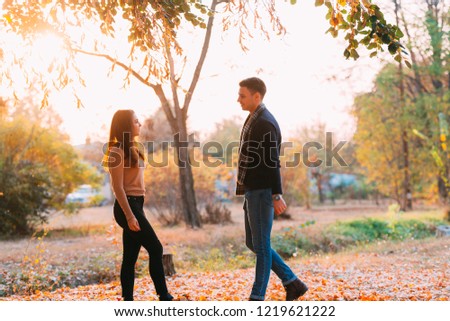 Young wild and free couple spending some quality time in a park.