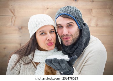 Young Winter Couple Against Bleached Wooden Planks Background