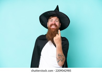 Young Wizard In Halloween Isolated On Blue Background Doing Coming Gesture