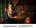 Young wizard reading ancient magic book with glowing magical sparks in fantasy library interior. Magic school and spell casting concept.
