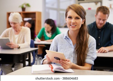 Young Woman At Adult Education Class Looking To Camera