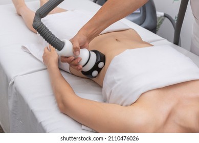 young woman in an aesthetic center performing a treatment for the beauty of the skin and body with the method of velaslim plus applied by an aesthetic professional - Shutterstock ID 2110476026