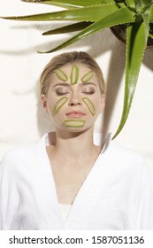 Young Woman With Aloe Vera Slices On Face