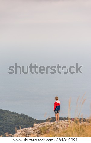 Image, Stock Photo Little girl jumping on a path of wooden boards in a wetland