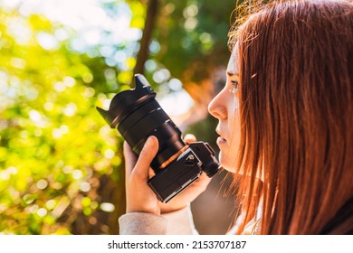 Young Woman Amateur Photographer, Taking Pictures Of A Mountain Landscape. Young Redhead Photographing Wildlife. Trip.