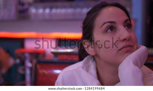 Young woman in an American\
Diner