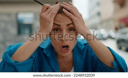 Young woman angry standing at street