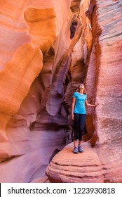 Young Woman In Antelope Canyon In Arizona. Tourist In Antelope Canyon. Adventure And Hiking Concept.