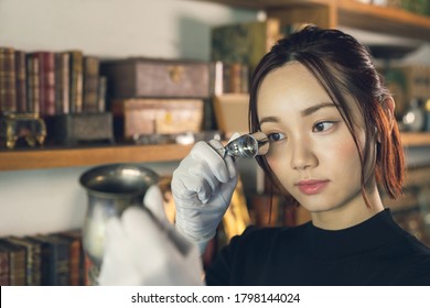 Young Woman In The Antique Shop. Appraiser.