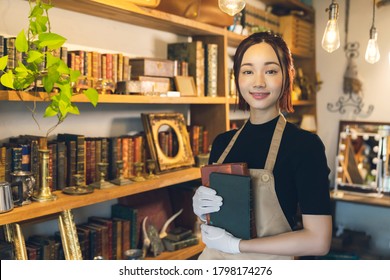 Young Woman In The Antique Shop. Appraiser.