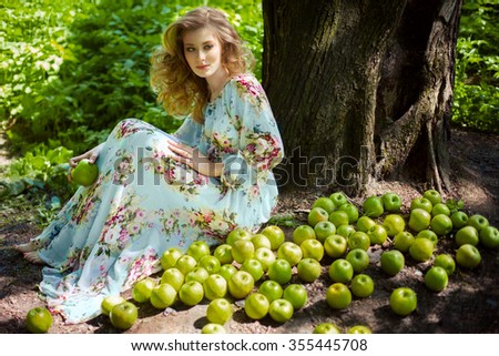 Young woman with apples 