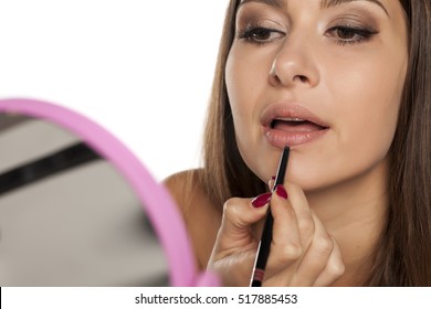 young woman applied lip liner
 - Powered by Shutterstock